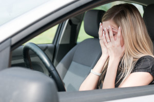 Unhappy Woman In Driver's Seat of Car