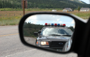 police car in side view mirror