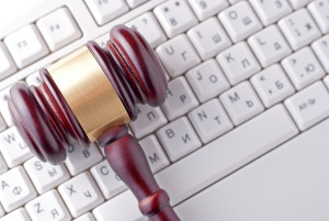 gavel on a keyboard and search of work computer