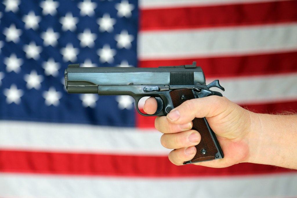 bigstock A pistol is held in front 111996575 1024x683 - Sentencing Guidelines for Possession of Weapons for Unlawful Purposes in Atlantic County